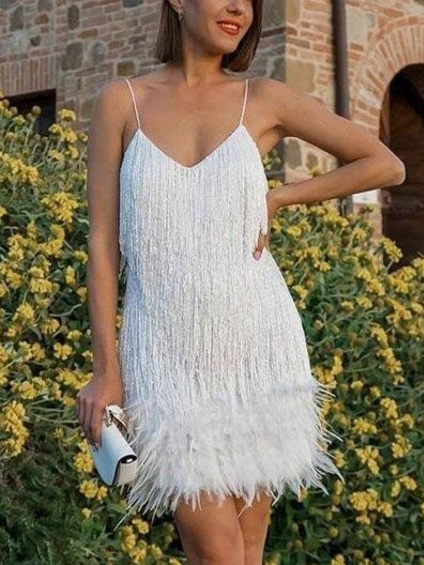 White mini dress with fringe and feather trim, V-neck, spaghetti straps