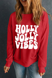Red crewneck sweatshirt with white "HOLLY JOLLY VIBES" graphic print