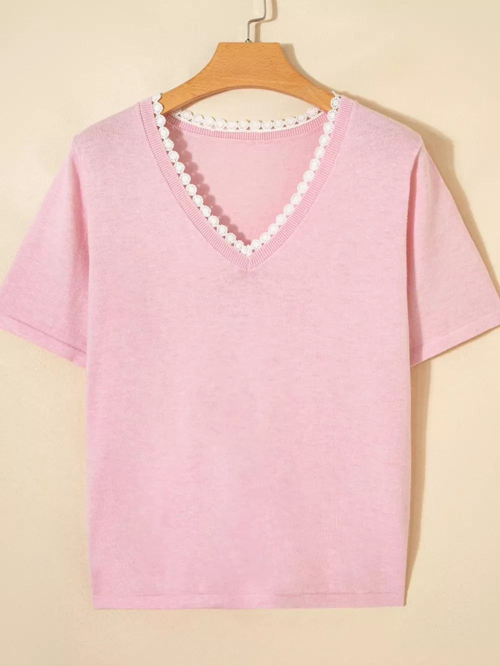 Pink knit v-neck top with delicate white lace trim