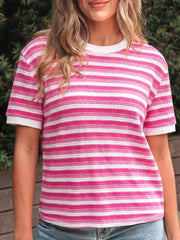 Textured knit tee with pink and white stripes, crew neck, short sleeves, and crossed detail.