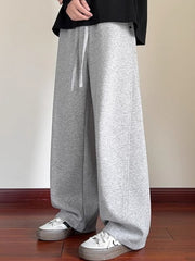 Men's gray drawstring wide-leg sweatpants with a comfortable fit.