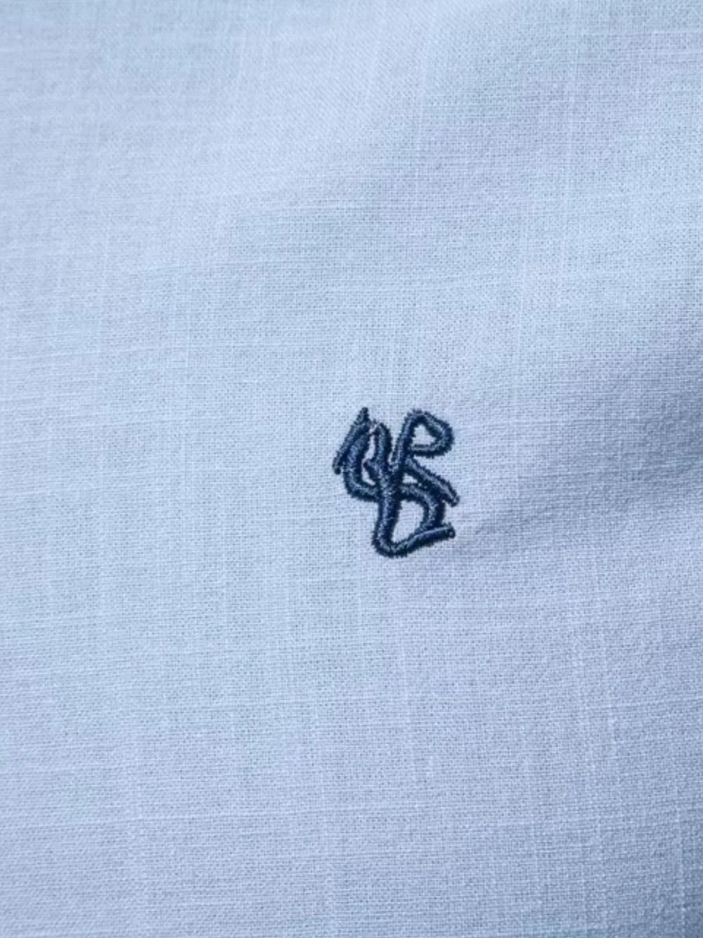 Light blue linen shirt with embroidered detail