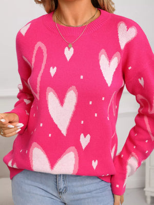 Heartfelt Fuchsia Knit Sweater with allover white hearts pattern, crew neck, and long sleeves.