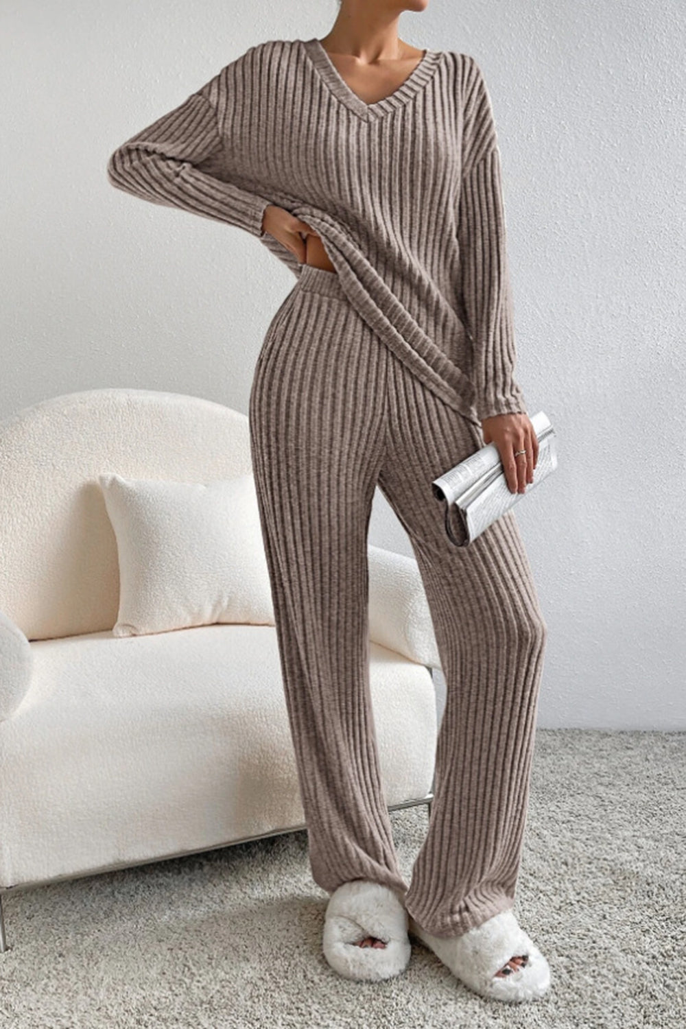 Ribbed knit lounge set in tan with V-neck top and wide-leg pants.