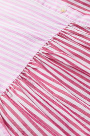 Pink striped tiered blouse with ruffle detail and button closure