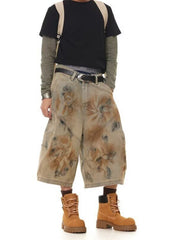 Men's vintage wash wide-leg denim shorts in beige with abstract pattern, cotton.