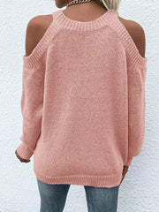 Pink cold shoulder knit sweater with crew neck and long sleeves.