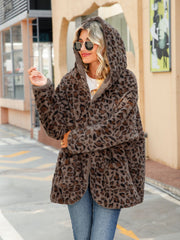 Leopard print sherpa hooded duster coat in chestnut with open front and pockets.