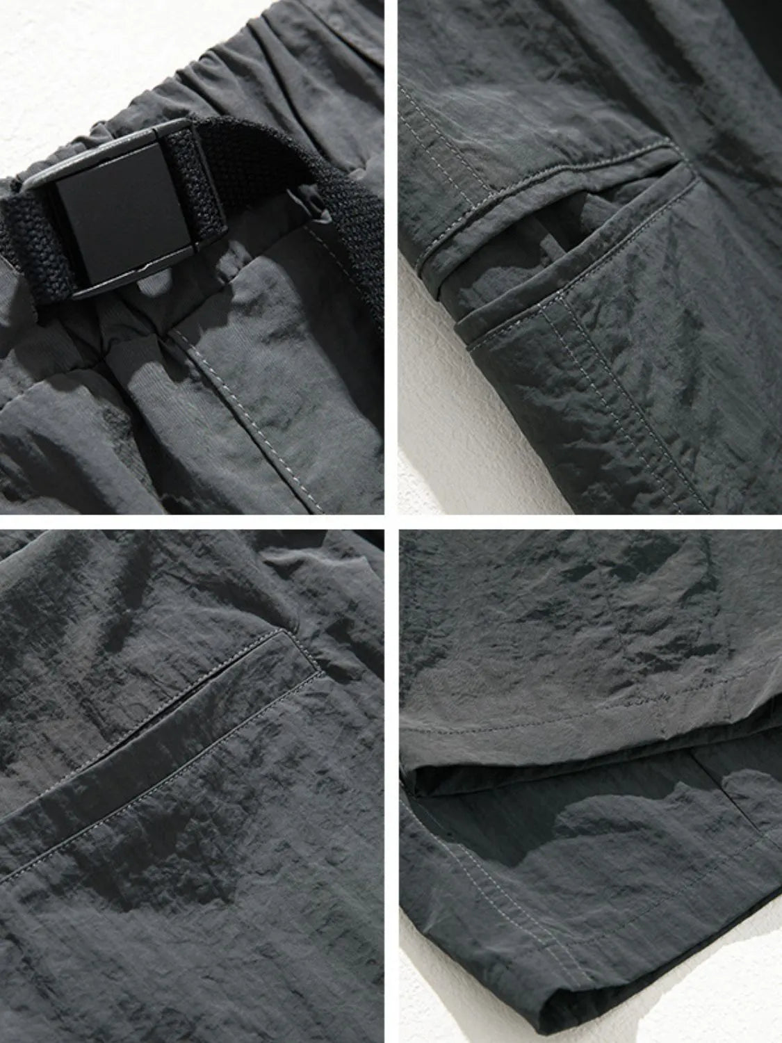 Dark gray technical fabric cargo pants with belt detail, cargo pockets, and stitching.