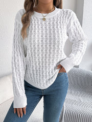 White acrylic cable knit sweater with asymmetric hem and crew neck.