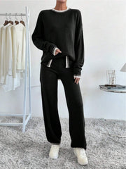 Black knit loungewear set with white trim detail on neckline, cuffs, and leg hem.