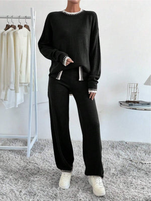 Black knit loungewear set with white trim detail on neckline, cuffs, and leg hem.