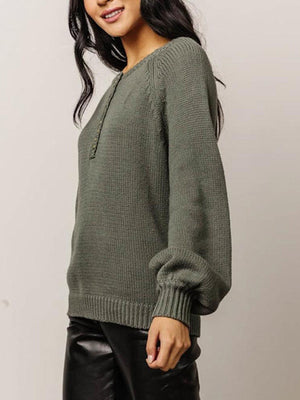 Army green acrylic henley sweater with balloon sleeves and button detail