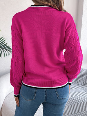 Hot Pink acrylic sweater with diamond knit sleeves and contrast trim neckline and hem.