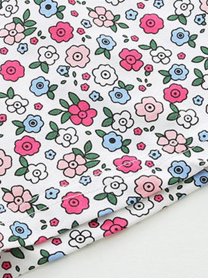 Girls' cotton bikini underwear with a white floral print in pink and blue.