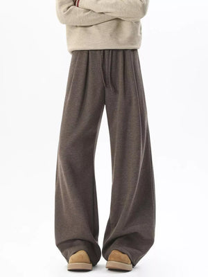Brown wide-leg sweatpants with adjustable drawstring waist and comfortable fit.