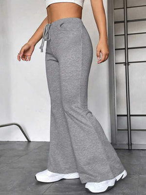 Heather gray flare leg lounge trousers with drawstring waist and pockets.