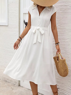 White cap sleeve midi dress with tie detail and buttons, a-line cut