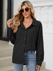 Black corduroy overshirt with buttoned patch pockets and a collared neckline.