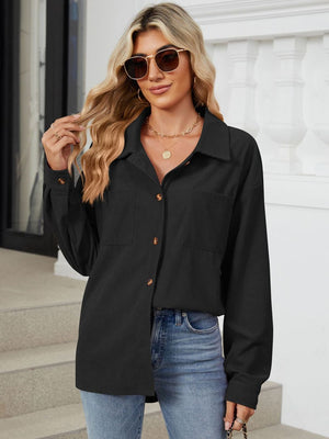 Black corduroy overshirt with buttoned patch pockets and a collared neckline.