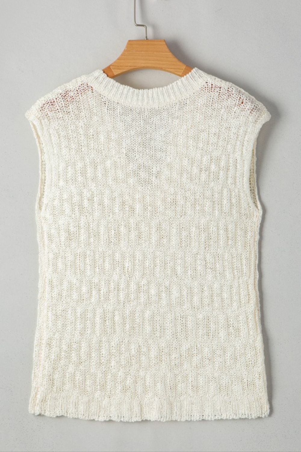 Textured knit shell top in beige with a crew neck and cap sleeves.