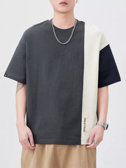 Oversized cotton t-shirt with color block design in dark gray, cream, and navy.