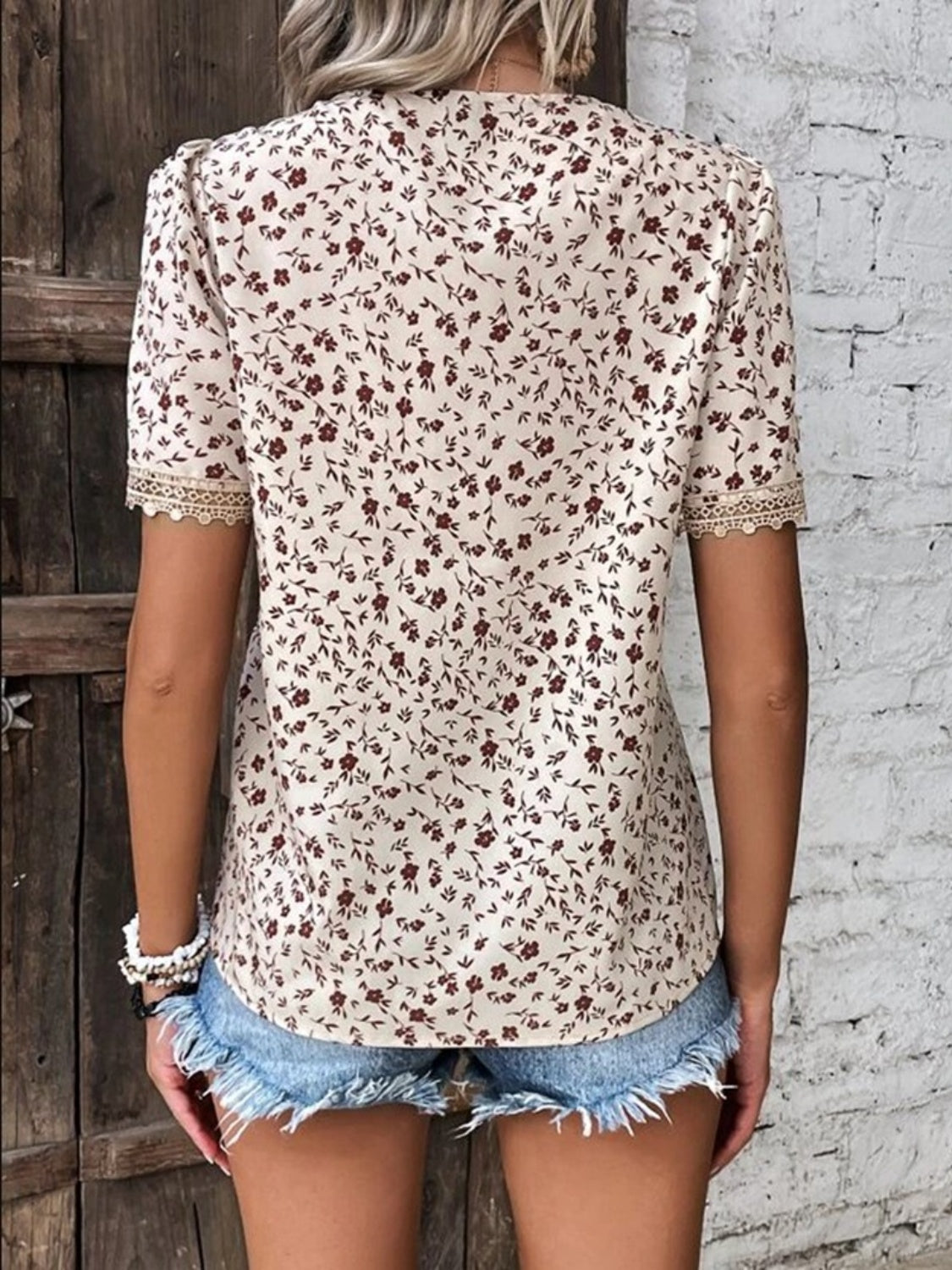 Floral lace trim V-neck blouse in tan with short sleeves and a ditsy floral print.
