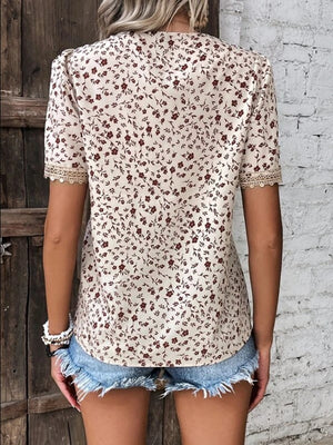 Floral lace trim V-neck blouse in tan with short sleeves and a ditsy floral print.