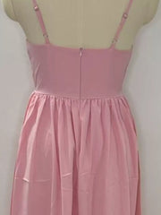Blush pink midi dress with adjustable straps and a gathered waist