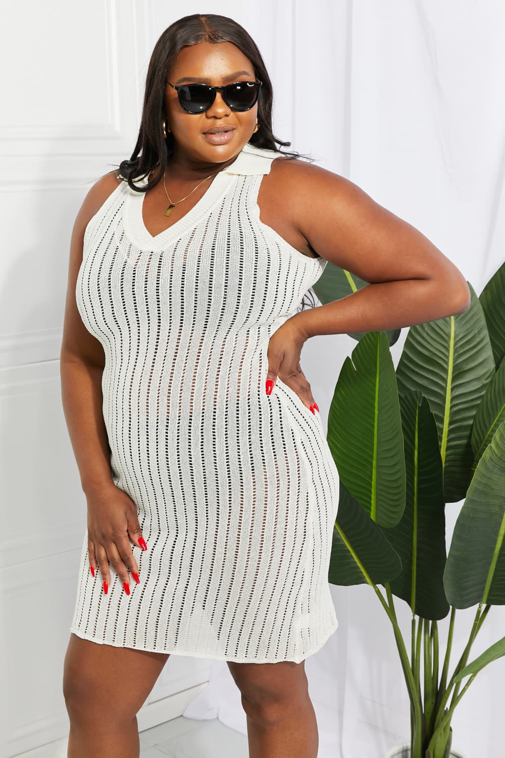 White open-knit collared midi cover-up with vertical stripe detail.