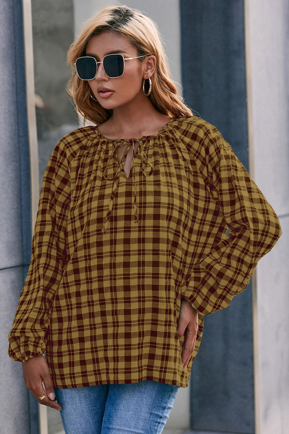 Gingham gathered neckline blouse in mustard and burgundy with balloon sleeves.