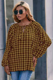 Gingham gathered neckline blouse in mustard and burgundy with balloon sleeves.