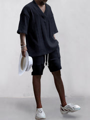 Black cable-knit V-neck two-piece set with shorts and short sleeves.