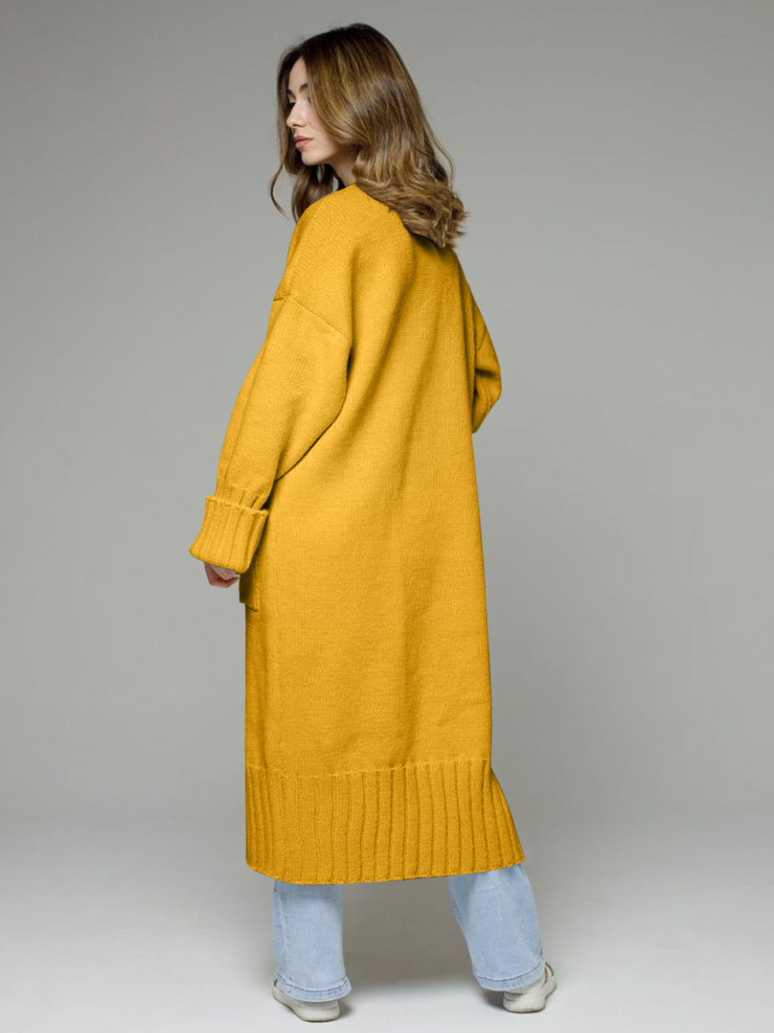 Oversized gold ribbed-trim maxi cardigan with cuffed sleeves and a ribbed hem.