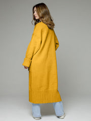 Oversized gold ribbed-trim maxi cardigan with cuffed sleeves and a ribbed hem.