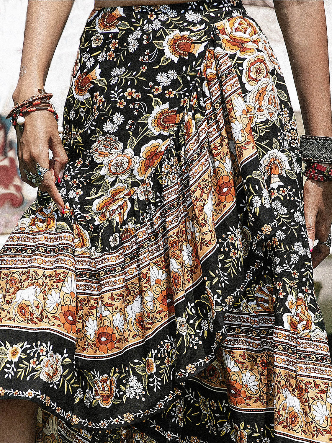 Bohemian floral asymmetric midi skirt with ruffle detail and multicolor print.