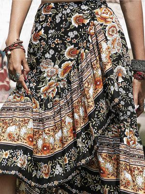 Bohemian floral asymmetric midi skirt with ruffle detail and multicolor print.