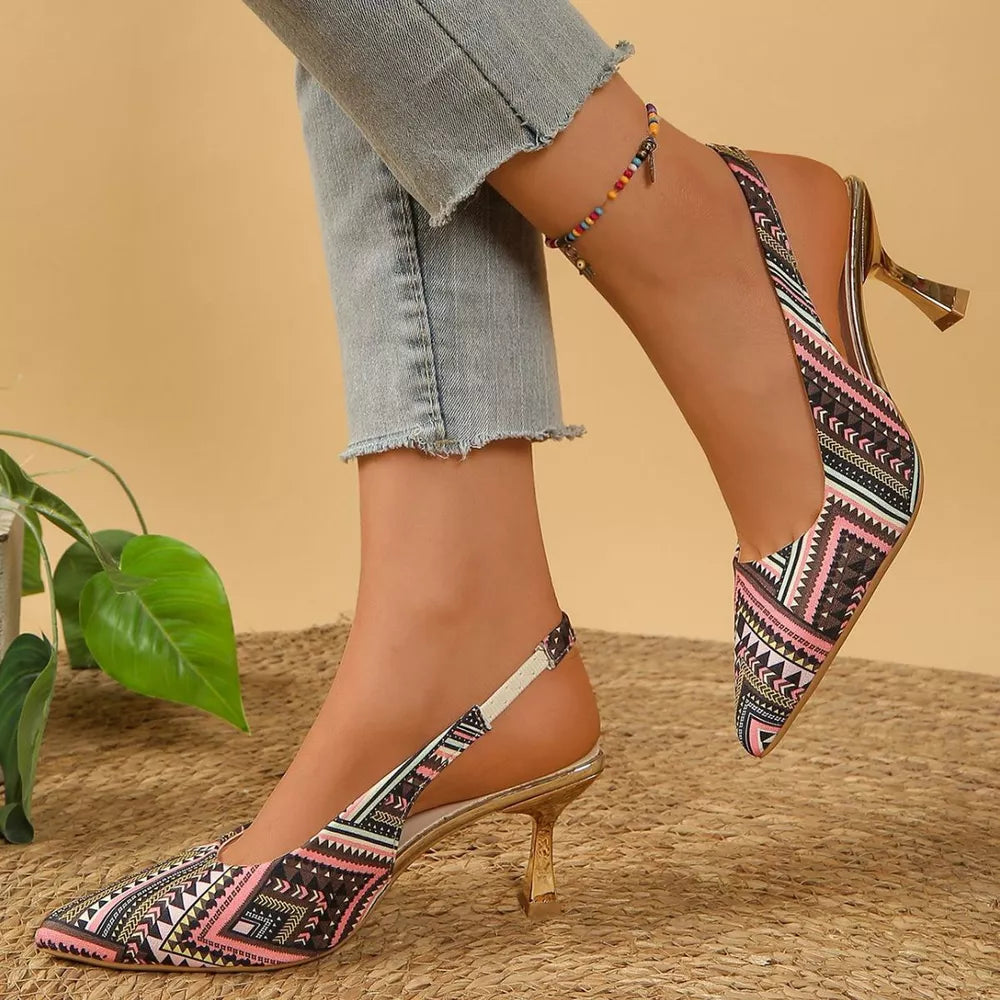 Geometric patterned slingback kitten heels in multicolor with a pointed toe and gold heel.