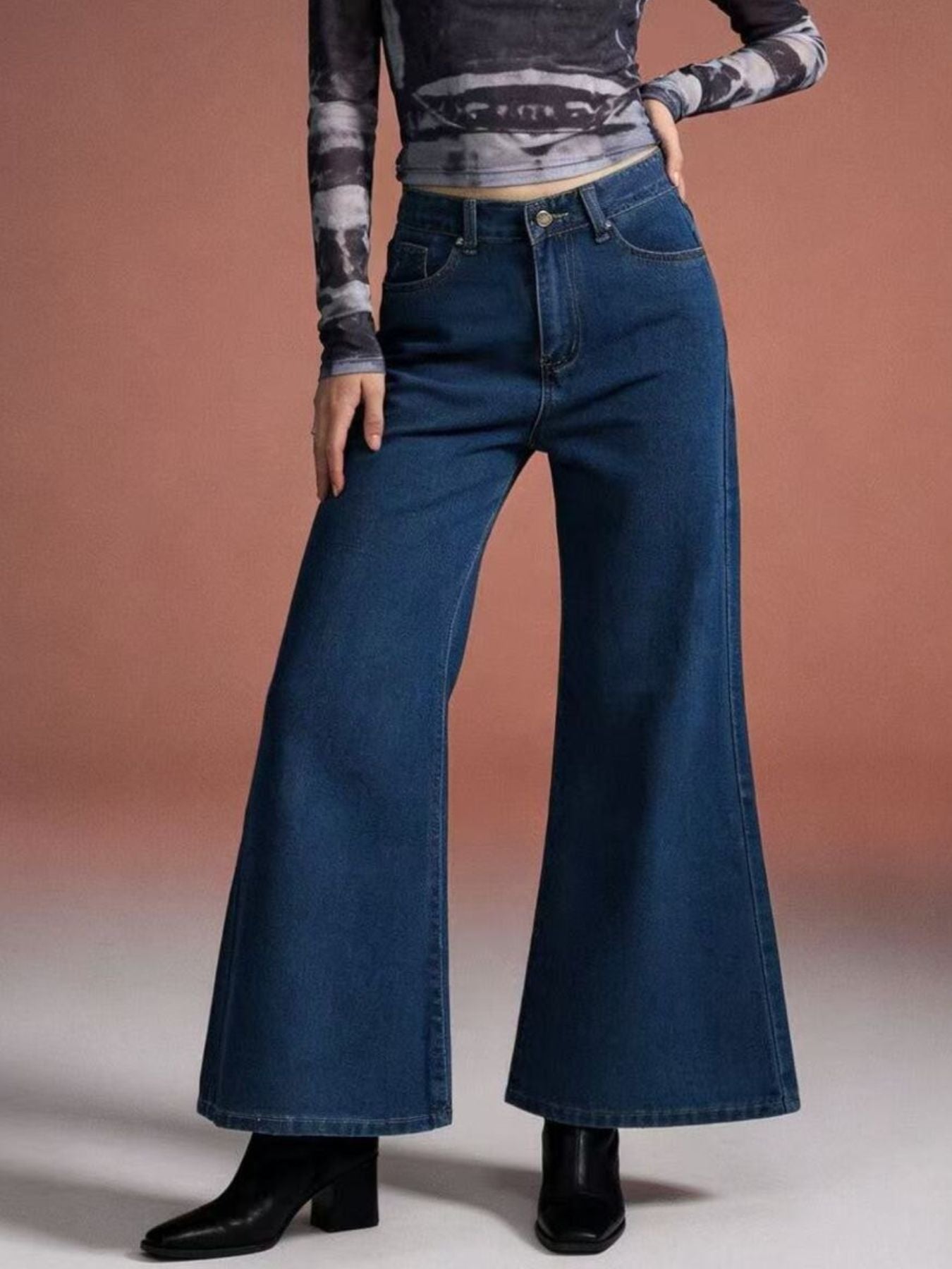 Maternity high-waisted flare jeans in dark wash denim with a comfortable cotton blend fabric.