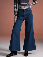 Maternity high-waisted flare jeans in dark wash denim with a comfortable cotton blend fabric.