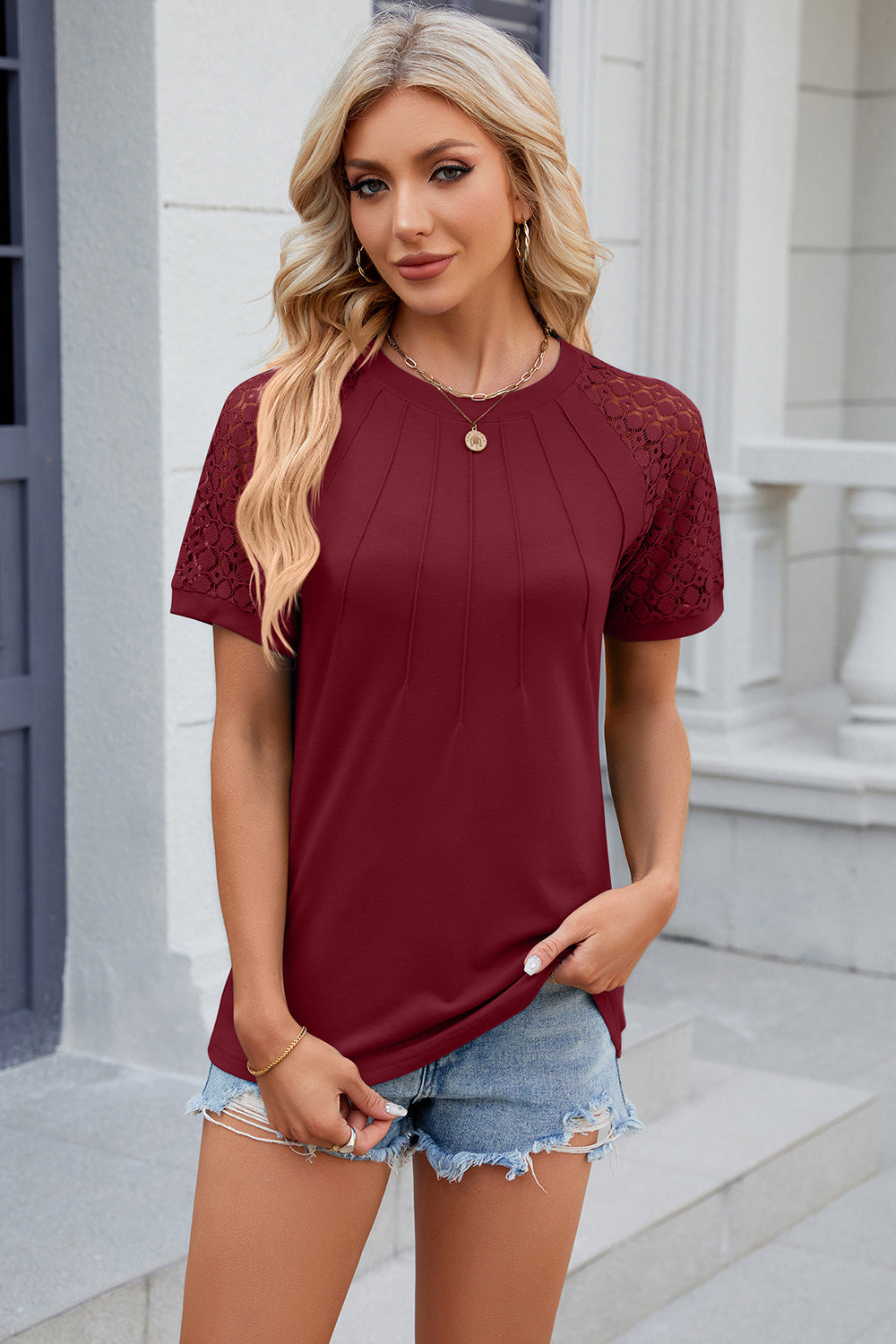 Burgundy ribbed tee with lace raglan sleeves and pintuck detail on the front.