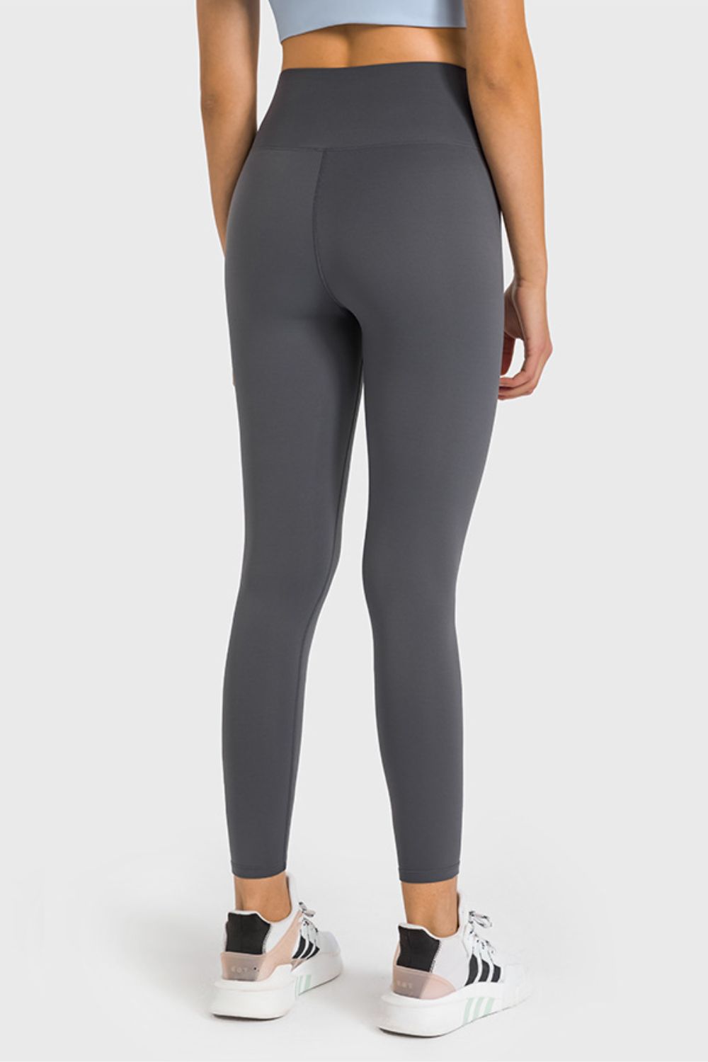 Gray high-waist performance leggings with ankle length and a seamless back.