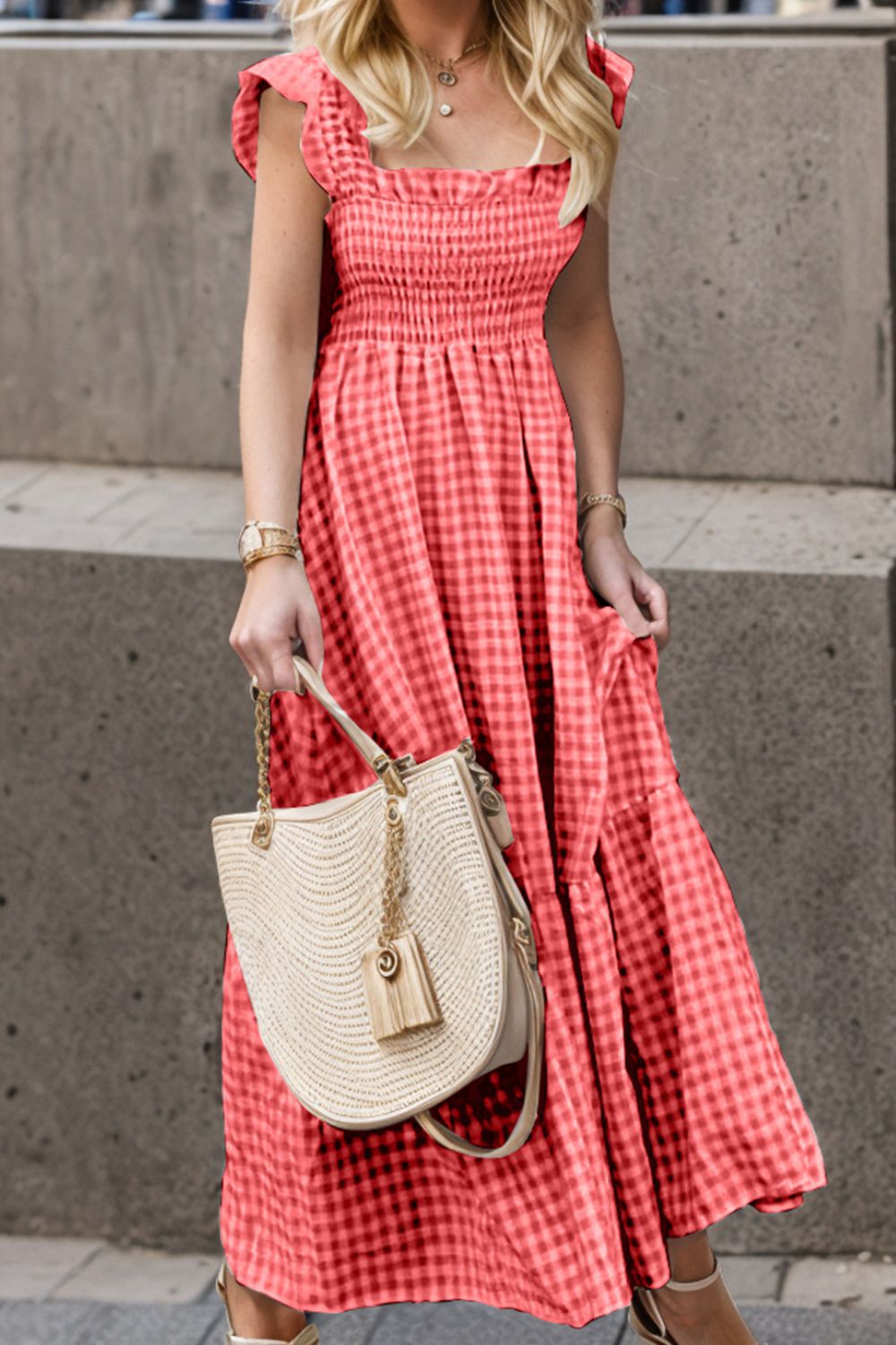 Smocked gingham maxi dress with flutter sleeves and ruffle hem.