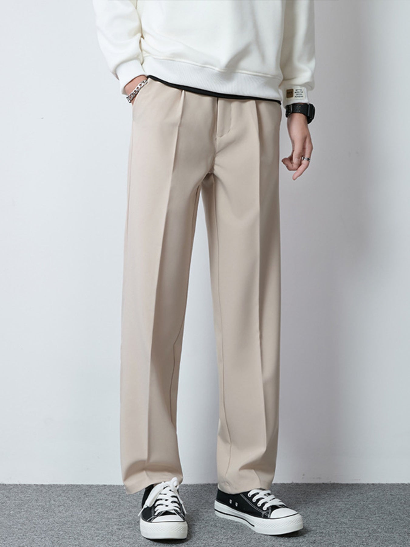Men's Khaki wide-leg casual pants with a relaxed fit and pleats.