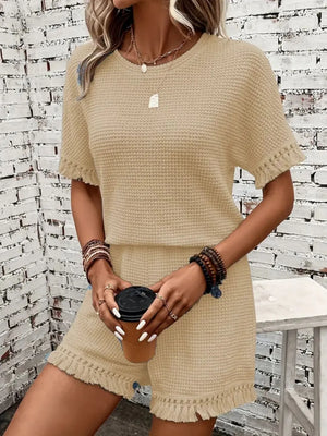 Tan textured knit set with fringe detail on short sleeves and shorts.