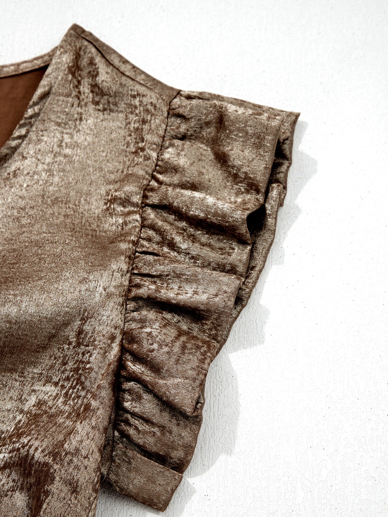 Elegant gold ruffled neck tank top with cap sleeves and a textured sheen.