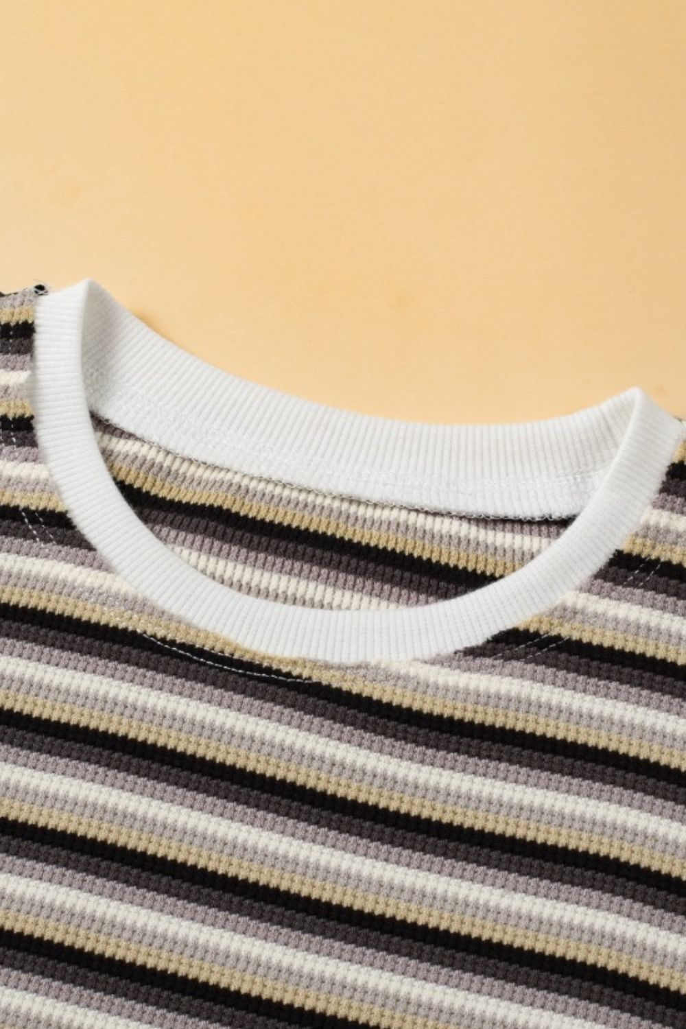 Rainbow stripe cotton jumpsuit with crew neck and ribbed trim