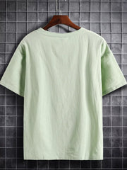 Light green cotton crew neck t-shirt with short sleeves.