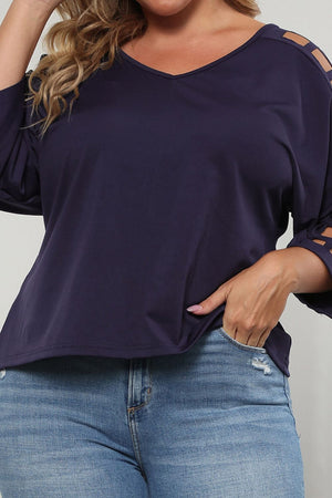 Dark navy v-neck blouse with lattice detail on the sleeves.
