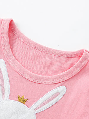 Pink toddler dress with bunny applique and gold crown detail.
